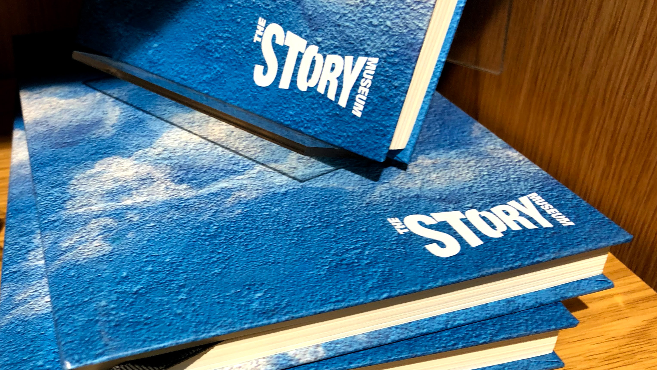 The Story Museum Oxford blue sky mural notebooks